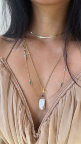 Pearl & Teal Sapphire Pendant 18k gold handmade fine jewelry on model