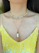 Pearl & Teal Sapphire Pendant 18k gold handmade fine jewelry on model 2