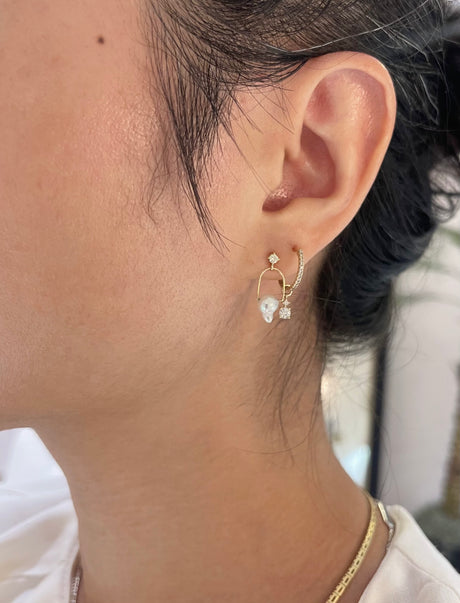 Pearl diamond earrings in gold on model 