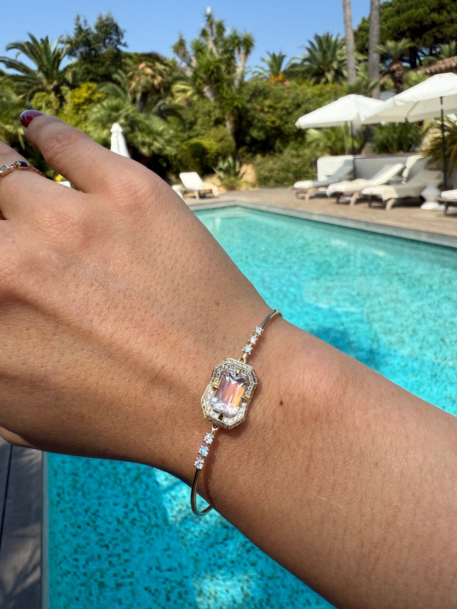 Rainbow Moonstone Aurora Bangle 18K gold stackable design on model