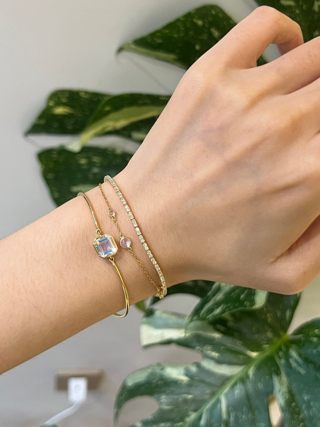 Rainbow Moonstone Bar Bangle 18k gold stackable design on model