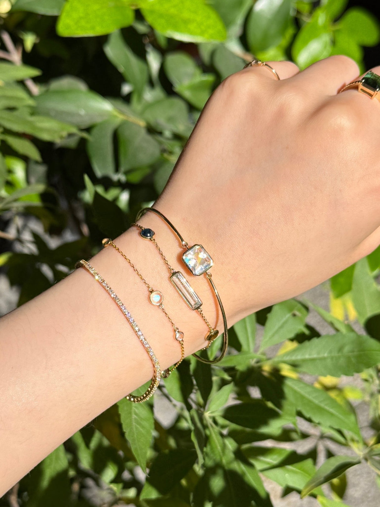 Rainbow Moonstone Supreme Bangle 18k gold Stackable design on model