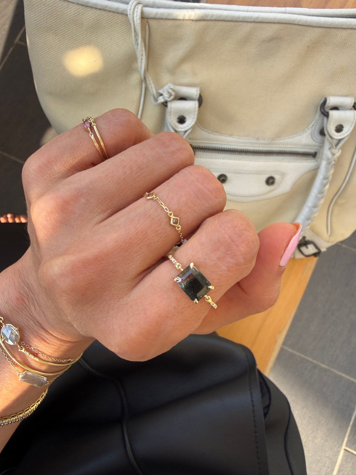 Raven Watermelon Tourmaline Petite Circle Diamond Ring 18K gold stackable ring on model 1