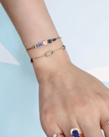 Sapphire_Compass_Bangle_Blue_18K_gold_stackable_design_on_model_2