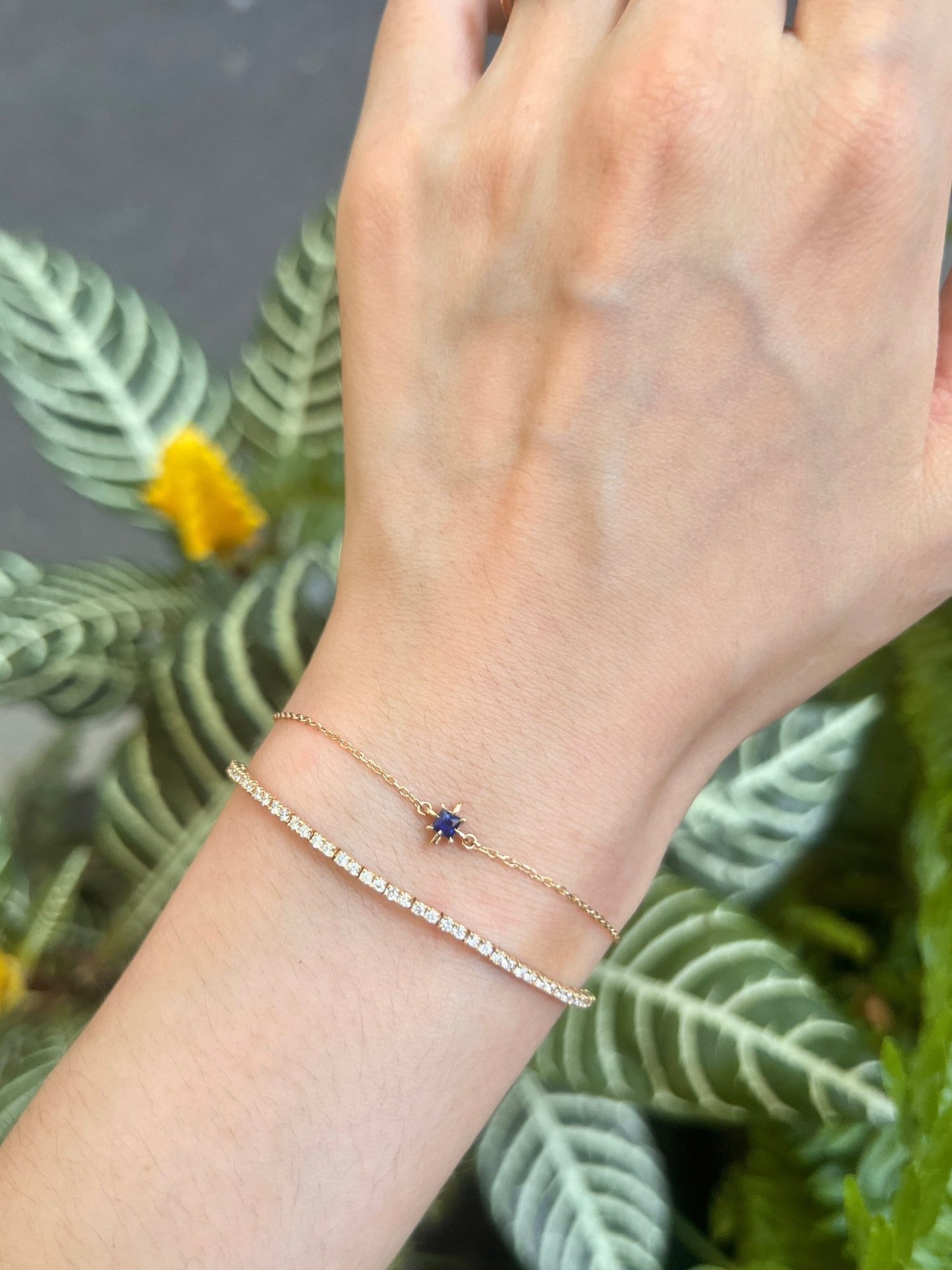 September Birthstone Sapphire Bracelet 14k gold stackable design on model