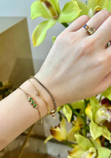 Tsavorite Orbit Bangle 18k gold stackable design on model