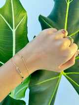 Tsavorite Trillion Bracelet 18k gold stackable design on model