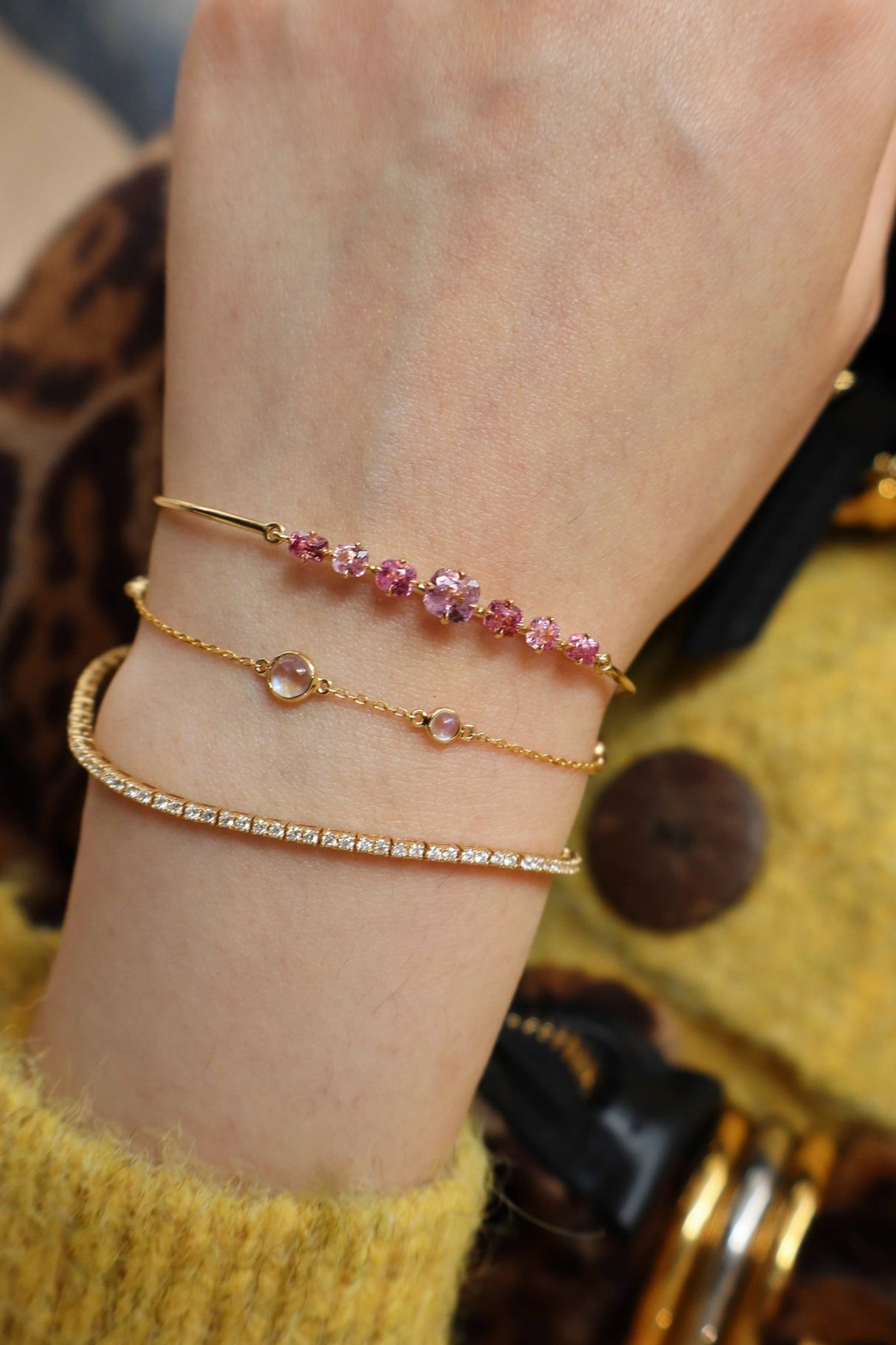 Vivid Pink Spinel Compass Bangle 18k gold stackable design on model 2