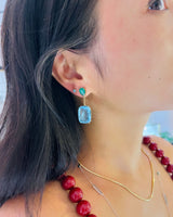 Emerald & Aquamarine Spring’s Dewdrop Earrings. Exquisite handcrafted 18k earrings by female artisans in our Bangkok studio. Vivid green emerald paired with aquamarines from Madagascar and emeralds from Gemfields. Sustainably sourced and adds just the right pop of color. 