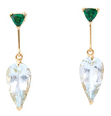 A pair of dangle earrings featuring vivid green tsavorite garnet at the top and clear Aquamarine stones in a teardrop shape at the bottom, set in gold mounting. Handmade by female artisans with sustainably mined gemstones 