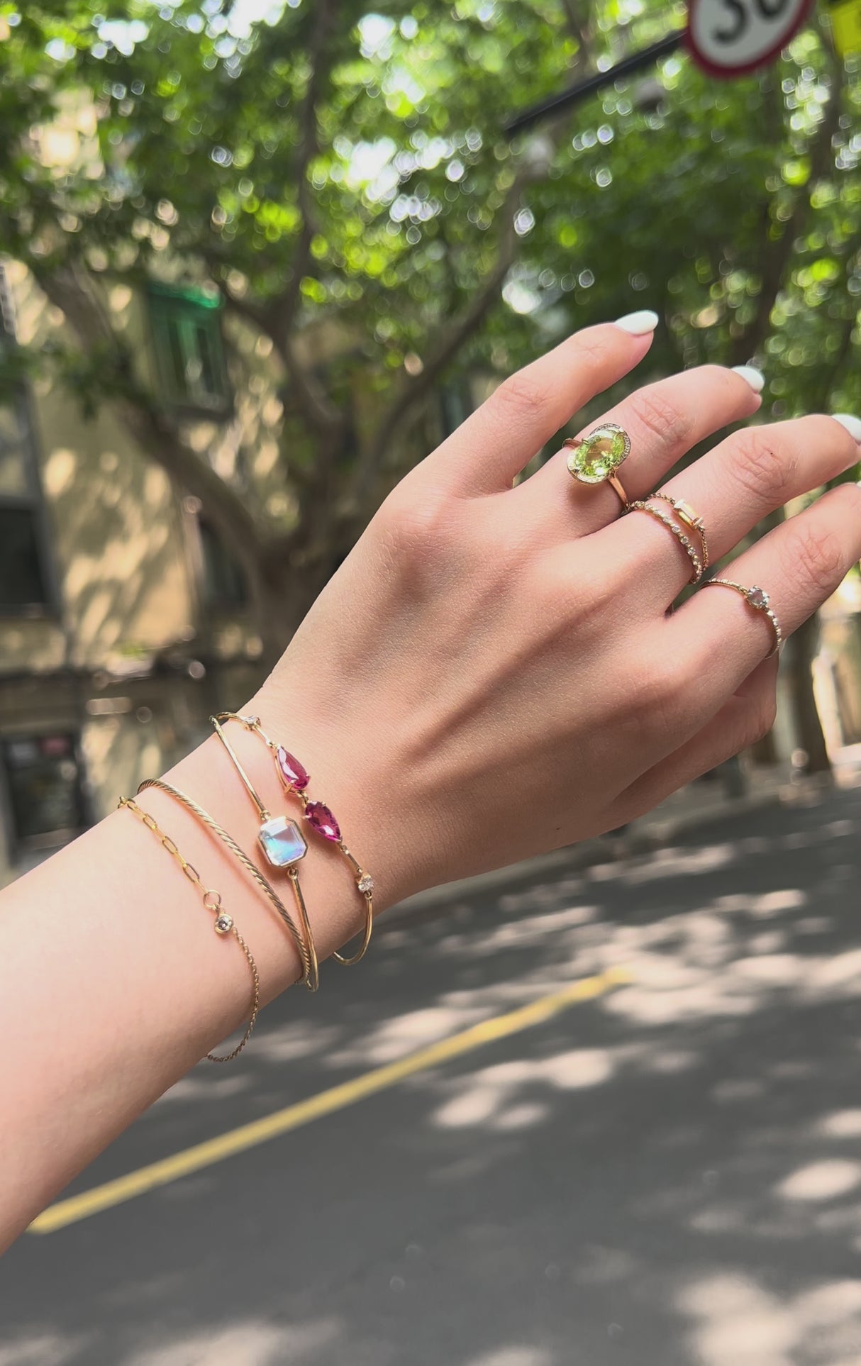 Rainbow Moonstone Bar Bangle 18k gold stackable design on model