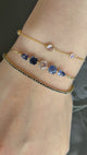 Sapphire Compass Bangle 18K gold stackable design on model 